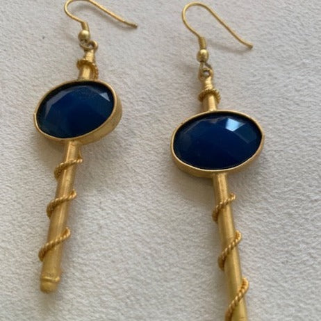 Striking gold earrings with blue stone