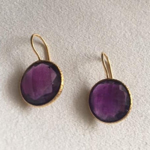 Gold earrings with Purple stones.